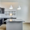 kitchen showing counterspace and bright lighting and modern appliances