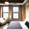 large windows brighten loft style bedroom