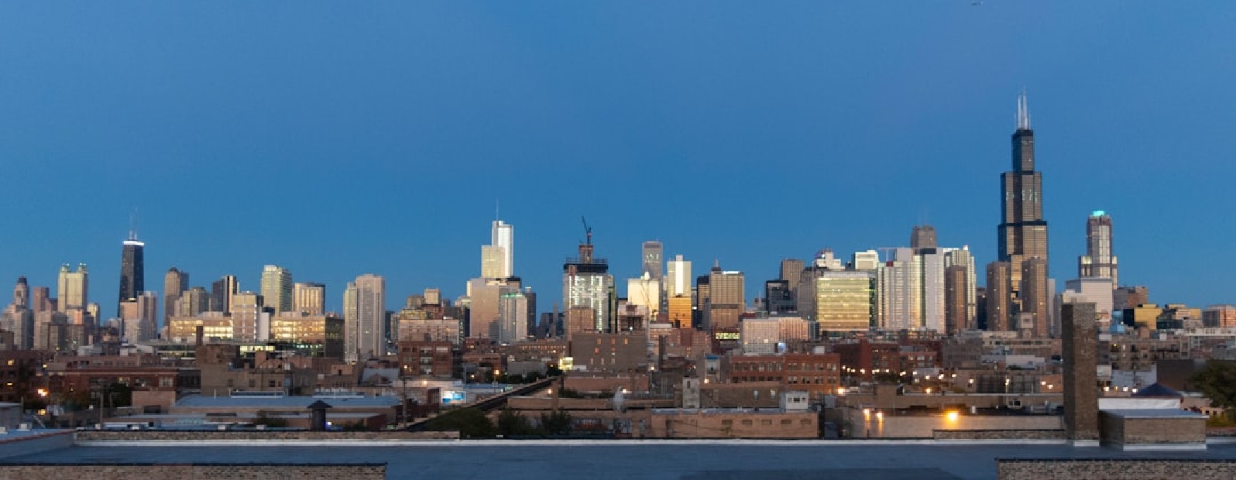 Modern Chicago apartment rooftop deck with skyline views - chicago apartment amenities